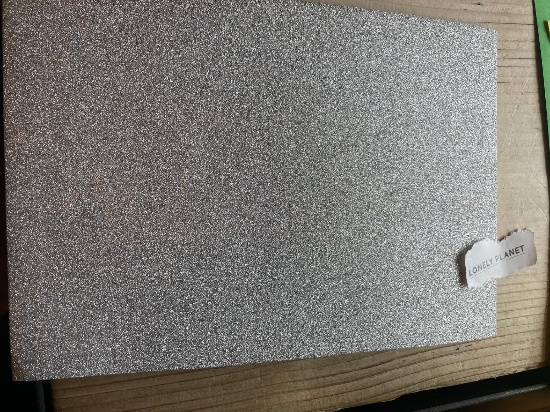 A white piece of paper on a wood surface

AI-generated content may be incorrect.
